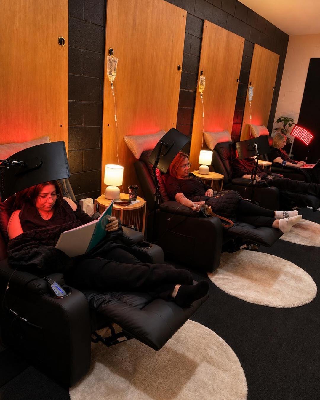 IV Services lounge with recliners and red light at Longevity Lab